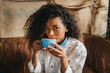 © Jake Jakab/ADDICTIVE STOCK - Woman drinking cup of coffee
