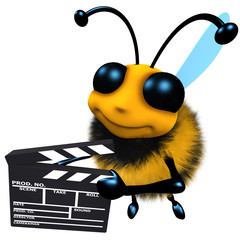 Wall Mural - 3d Funny cartoon honey bee character holding a movie makers clapperboard