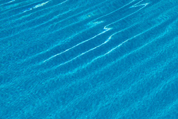 Wall Mural - water texture in a pool with waves and reflection