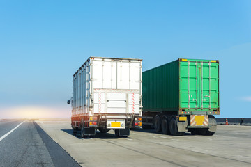 Truck on highway road with container, transportation concept.,import,export logistic industrial Transporting Land transport on the asphalt expressway with blue sky