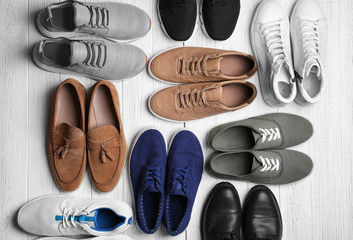 Poster - Different male shoes on light background