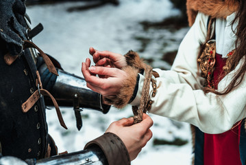 man ties a woman's hands together