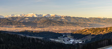 Panorama Of Spierlberg-city In Austria With Red Bull Ring Race Circuit With Alps Covered With Snow In Background.