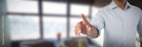 Cuadros en Lienzo Composite image of man pretending to touch an invisible screen