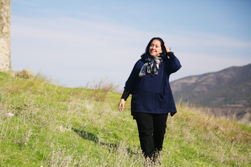 Outdoor portrait of happy 40 years old woman