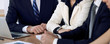 © rogerphoto - Group of business people or lawyers  at meeting, hands close-up