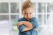 © Jakob/Stocksy - Young boy with wild hair looking defiant