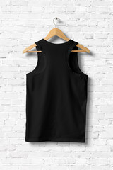 Wall Mural - Black Tank Top Shirt Mock-up hanging on white wall, rear side view. 3D rendering.