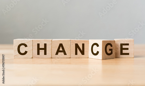 Fotomural Wooden cube flip with word change to chance on wood table, Personal developm