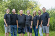 portrait of a senior couple with their five adult children. This large attractive family of adult children with their senior parents
