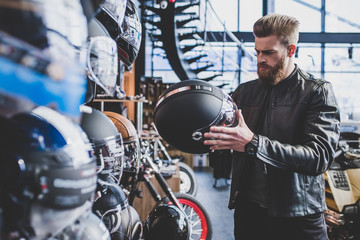 Wall Mural - Man in motorcycle shop