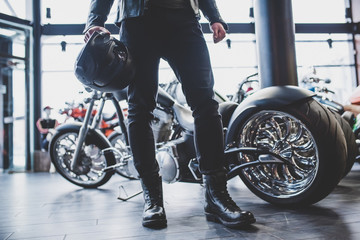 Wall Mural - Man in motorcycle shop