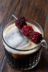 Poster - Black / Dark Beer Cocktail with Blackberries and Ice on Wooden Surface.