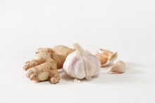 Garlic Heads And Ginger Root On White Background