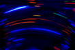 Multicolored curved lines glowing in the dark. abstract colored lines of light. screensaver