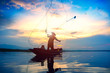 © Patrick Foto - Silhouette fisherman throwing fishing net during sunrise