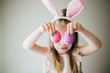 © MeganBetteridge - Little Girl Holding Easter Eggs in front of eyes