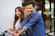 © chinnarach - close up on asian indian man smiling with girlfriends at outside shopping mall concept
