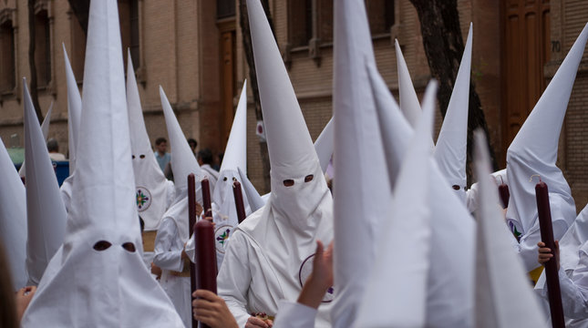 the processions of the hooded dressed in white