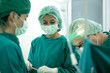 © Bavorndej - The surgery team working together at the operating room in the hospital.