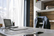 © artursfoto - Empty workplace with office desk and chair, jacket on the chair, manager on the break
