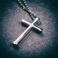 Poster - Silver cross on a gray background