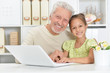 © aletia2011 - girl and grandfather with a laptop
