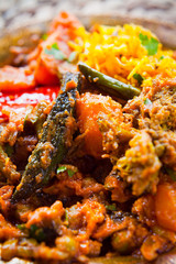 Poster - Indian Vegetable Curry with saffron rice on traditional metal plate.