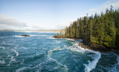 Aerial panoramic seascape view during a vibrant winter morning. Taken near Tofino and Ucluelet, Vancouver Island, British Columbia, Canada.