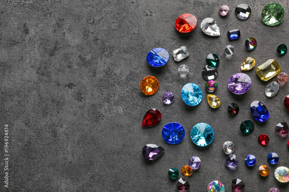 Colorful precious stones for jewellery on dark background
