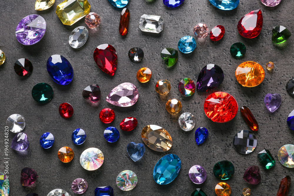 Colorful precious stones for jewellery on dark background