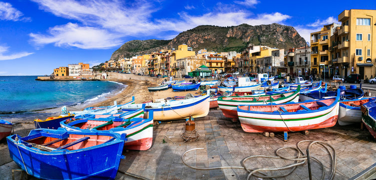 traditional fishing village aspra with colorful boats in sicily. italy