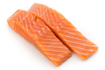 Fresh salmon fillet with basil on the white background.