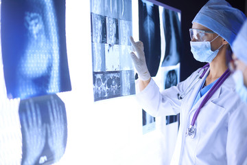 Two female women medical doctors looking at x-rays in a hospital