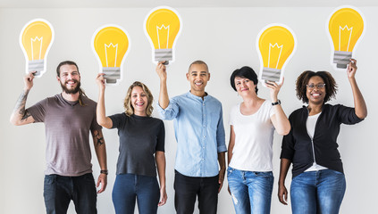 Wall Mural - People carrying light bulb icons