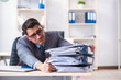 © Elnur - Overloaded with work employee under paperwork burden