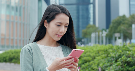 Poster - Woman working on cellphone at outdoor