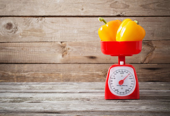 pepper on red kitchen scales