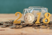 Bitcoin And Wood Text Year 2018 On Coins Stack , Cryptocurrency Concept