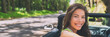 © Maridav - Asian car driver woman smiling happy relaxing in convertible car on summer road trip vacation. Travel destination driving through Hawaii, banner panorama.