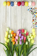 © 1981 Rustic Studio - Colorful Easter eggs and tulips on wood