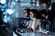 © metamorworks - Group of people looking at the futuristic user interface.