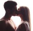 © Africa Studio - Young loving couple kissing on white background