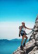 © XtravaganT - Fit attractive woman mountaineer