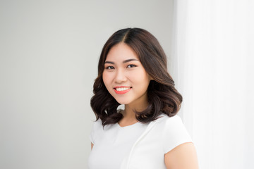 Wall Mural - Close up portrait of a professional business woman smiling outdoor