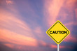 Yellow transportation sign post with caution word on violet sky with cloud background and have copy space