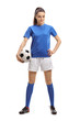 Female soccer player with a football