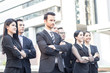 © khwanchai - Teamwork and professional partnership concept, businesspeople team of multi ethnic standing  with confidence in full suit.