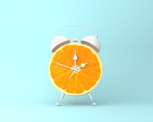 Creative idea layout fresh orange slice alarm clock on pastel blue background. minimal idea business concept. fruit idea creative to produce work within an advertising marketing communications