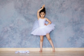 Little girl ballerina in a white tutu